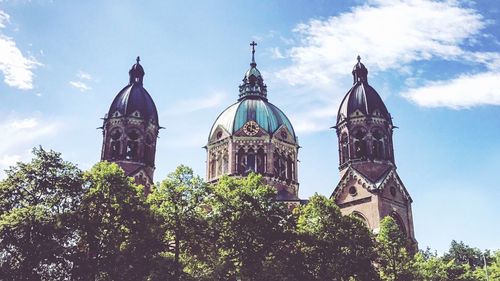 Low angle view of cathedral against cloudy sky