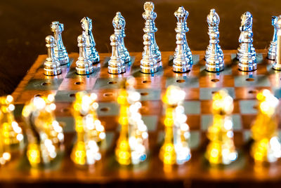 High angle view of chess pieces on board