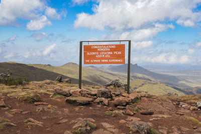 A sign post at the summit of ol doinyo la satima in the aberdares, kenya