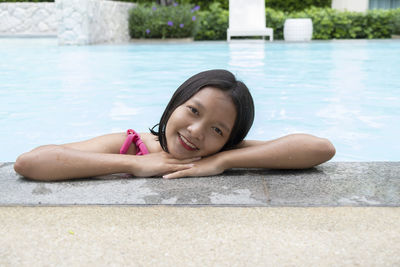 Portrait of smiling girl in swimming pool