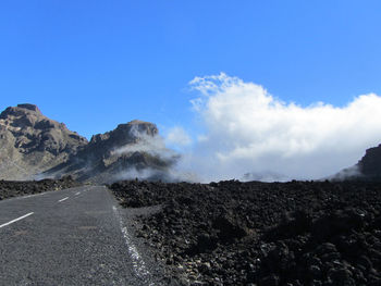 Scenic view of mountain road against sky