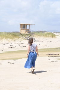 Rear view of woman on beach