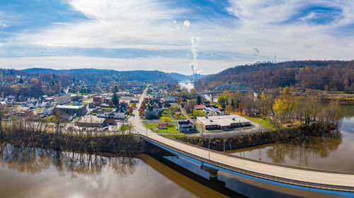 High angle view of river by trees against sky