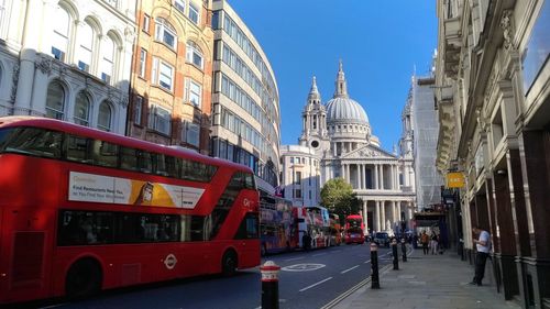 View of city street and buildings against sky