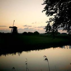 Scenic view of lake at sunset