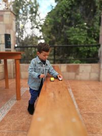 Boy playing with umbrella