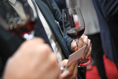 Cropped hand of woman holding wineglass