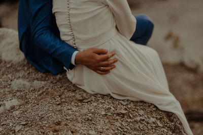 Low section of woman sitting on floor