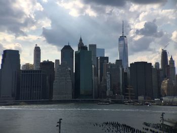 City skyline against cloudy sky