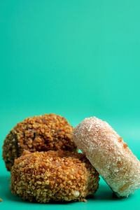 Close-up of bread on table against blue background