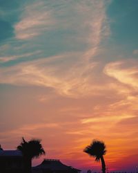 Silhouette trees against sky during sunset