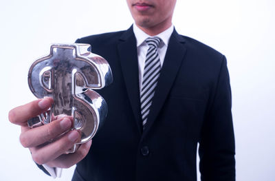 Midsection of a man holding camera