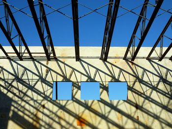 Low angle view of metallic structure against sky