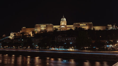 Illuminated buildings in city at night