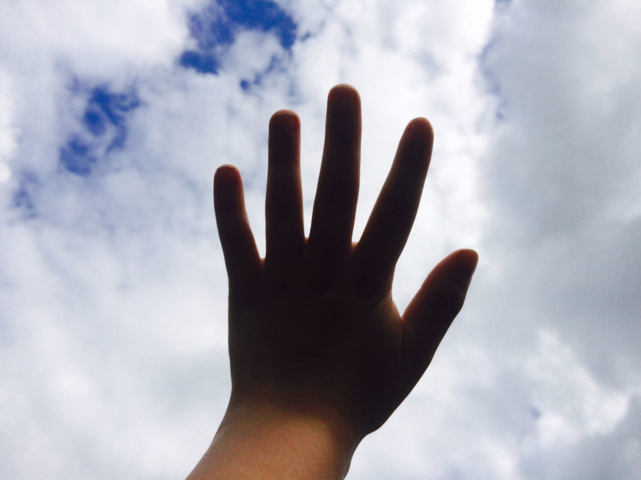 human hand, human body part, low angle view, cloud - sky, one person, palm, sky, real people, day, outdoors, adults only, people, adult