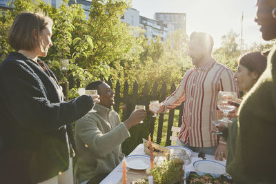 Friends having meal in garden