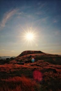 Scenic view of landscape against sky during sunset