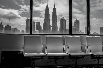 Modern office buildings against sky in city