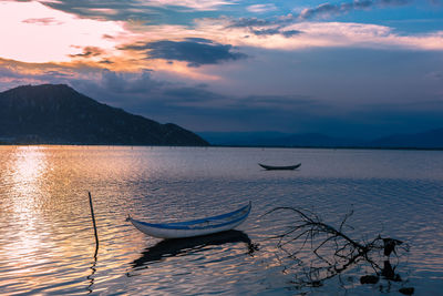 Scenic view of lake against sky during sunset