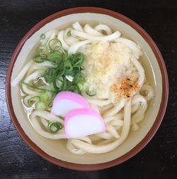 Close-up of udon noodles served on table