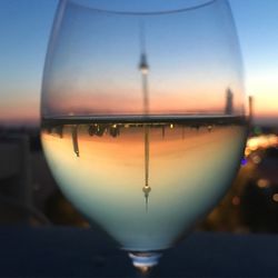 Reflection of tower in wineglass