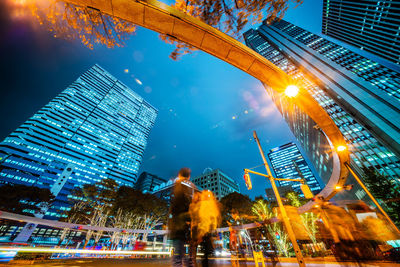 Low angle view of illuminated buildings at night