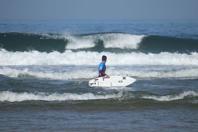 Man surfing in sea