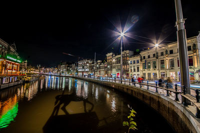 High angle view of illuminated buildings in city at night