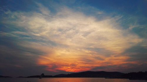 Low angle view of sea against sky during sunset