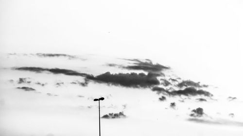 Low angle view of street light against sky