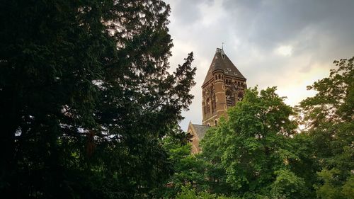 Low angle view of bell tower against sky