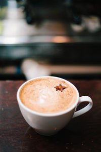 Close-up of cappuccino on table