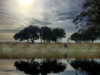 Scenic view of lake at sunset