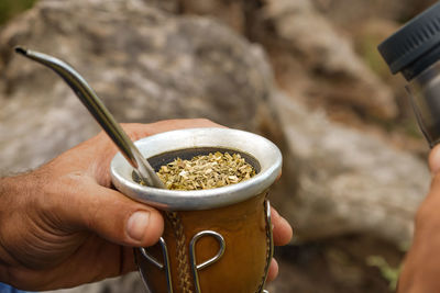 Close-up of hand holding coffee