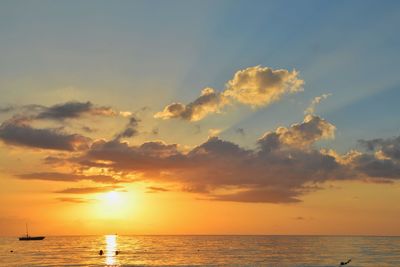 Scenic view of sea against sky at sunset