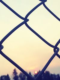 Close-up of metal against sky