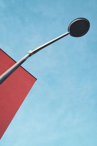 Low angle view of street light against sky