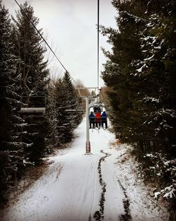 Overhead cable car at snow covered landscape