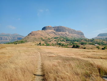 Scenic view of landscape and mountains against sky