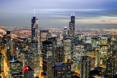 Aerial view of city lit up at night