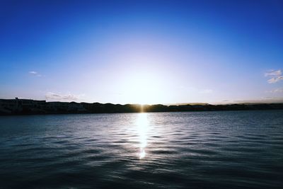 Scenic view of sea against blue sky