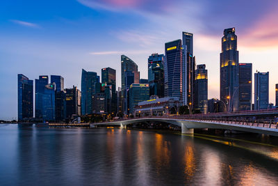 Illuminated city at waterfront