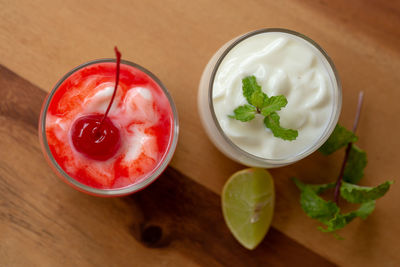 High angle view of fruit salad in glass on table