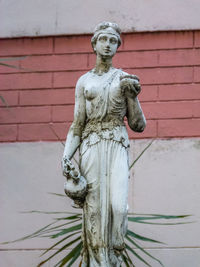 Statue against wall