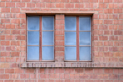 Full frame shot of window on brick wall