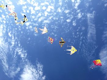 Low angle view of kite flying against sky