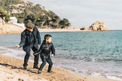 Full length of boys on beach