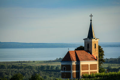 Church amidst buildings against sky