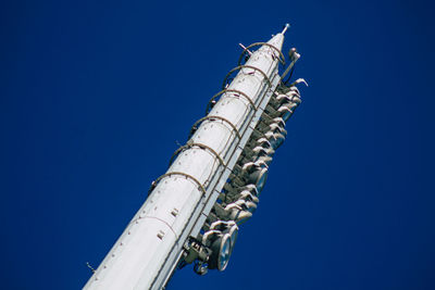 Low angle view of tower against blue sky