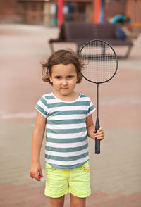 Portrait of cute girl standing